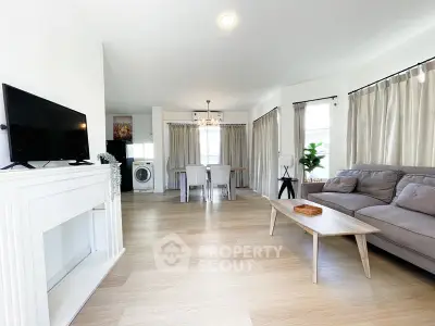 Spacious living room with modern decor and natural light