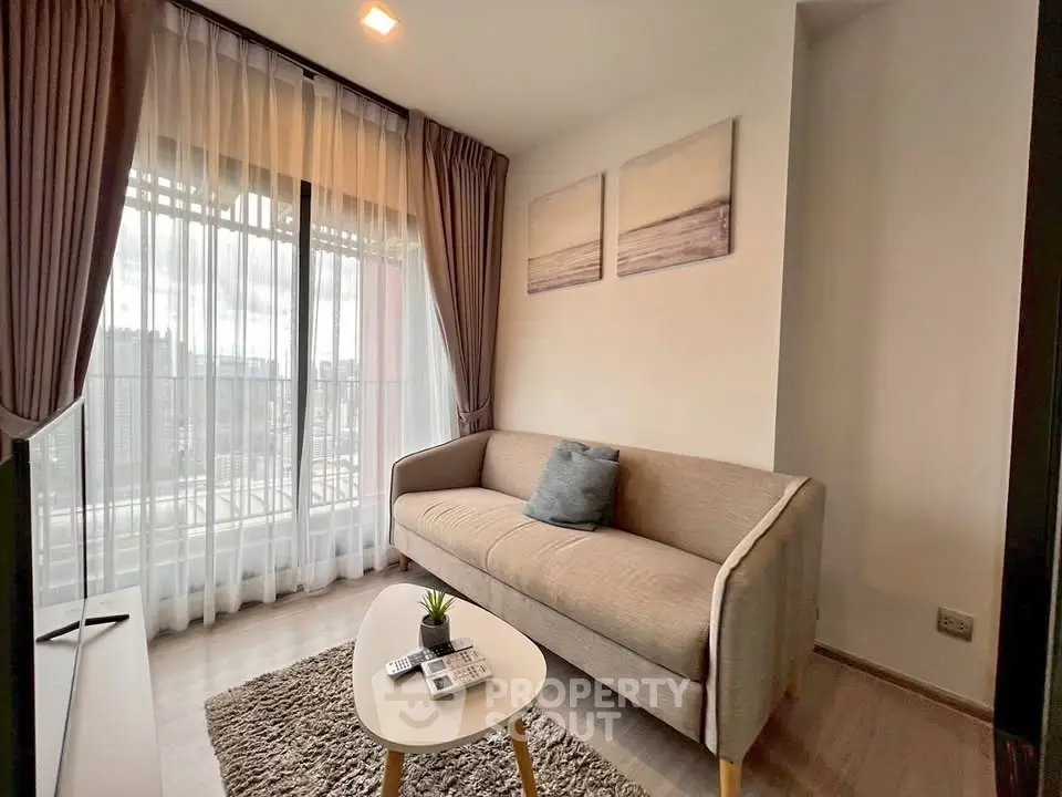Cozy modern living room with large window and stylish decor