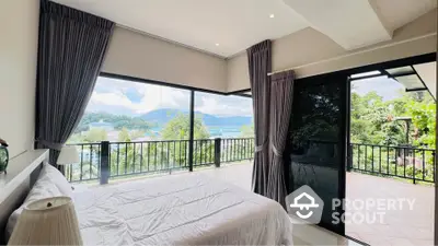 Luxurious bedroom with stunning panoramic view and spacious balcony access