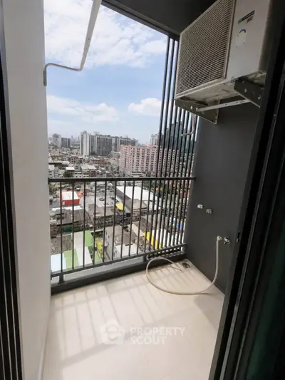 Modern balcony with city view and air conditioning unit, perfect for urban living.