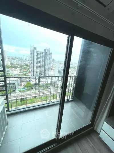 Stunning high-rise balcony view with cityscape panorama, perfect for urban living enthusiasts.