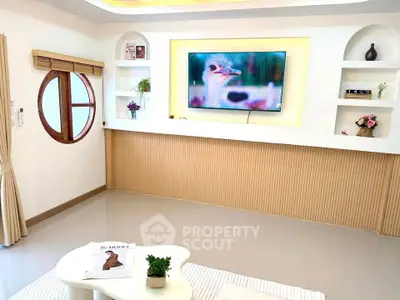 Stylish living room with modern decor and wall-mounted TV