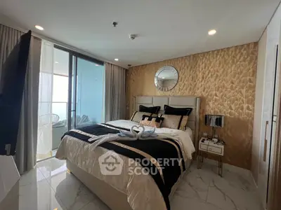 Luxurious bedroom with elegant decor and balcony access