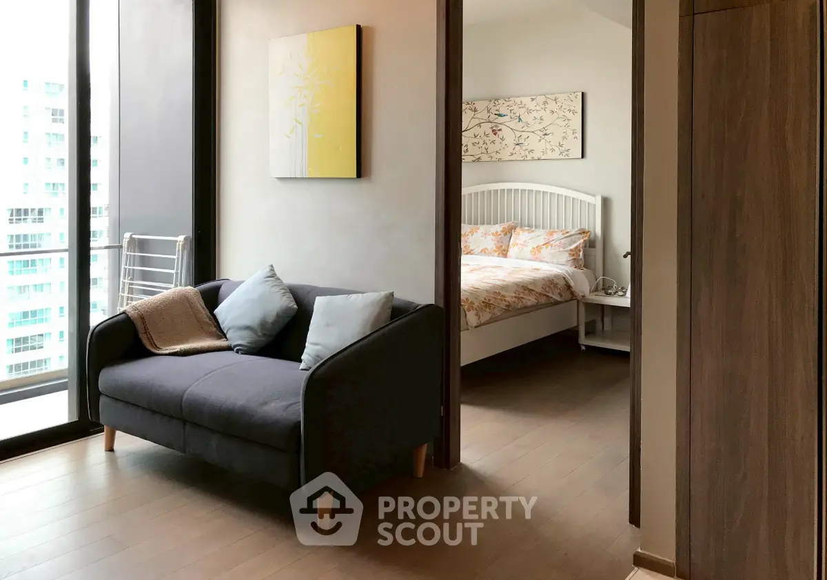Modern apartment interior with cozy living area and stylish bedroom view.