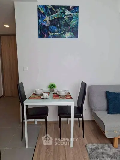 Modern dining area with stylish decor and cozy seating in a contemporary apartment.