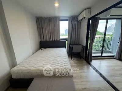 Modern bedroom with balcony view in stylish apartment