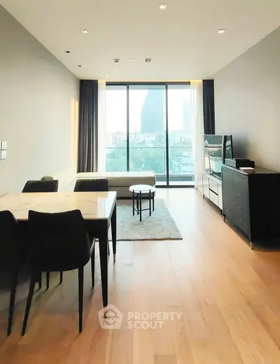 Modern living room with city view, sleek furniture, and natural light.