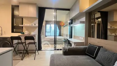 Modern studio apartment with open layout, featuring a cozy living area, sleek kitchen, and stylish bedroom.