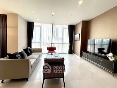 Spacious modern living room with large windows and elegant decor