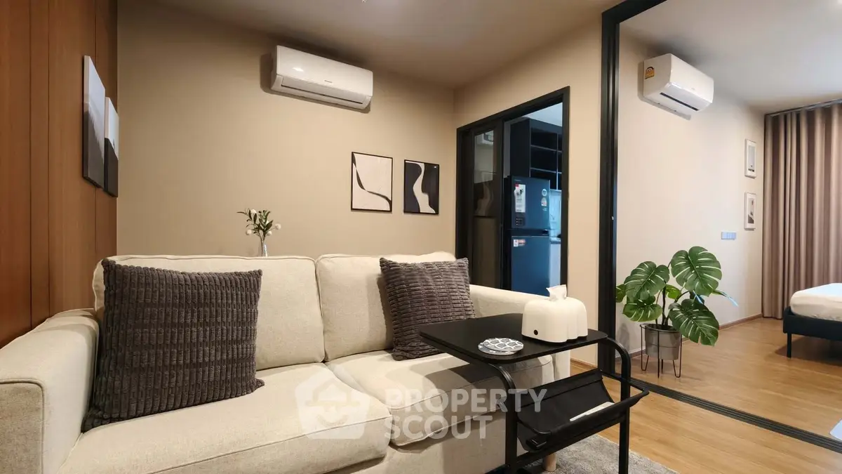 Modern living room with cozy sofa and air conditioning in stylish apartment