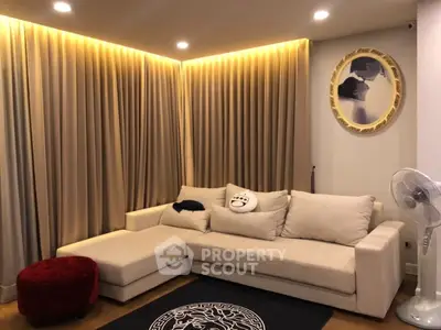 Cozy living room with elegant lighting and plush sectional sofa