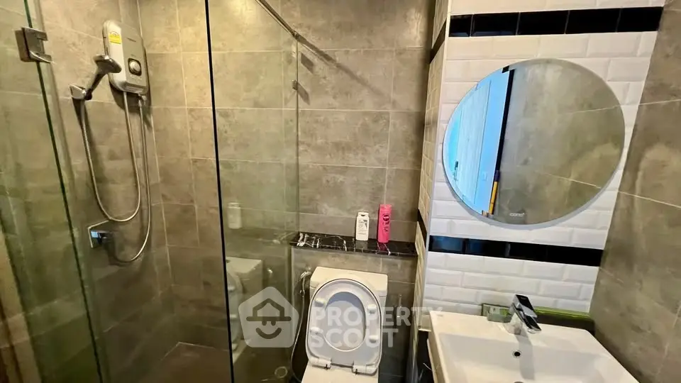 Modern bathroom with glass shower and sleek fixtures