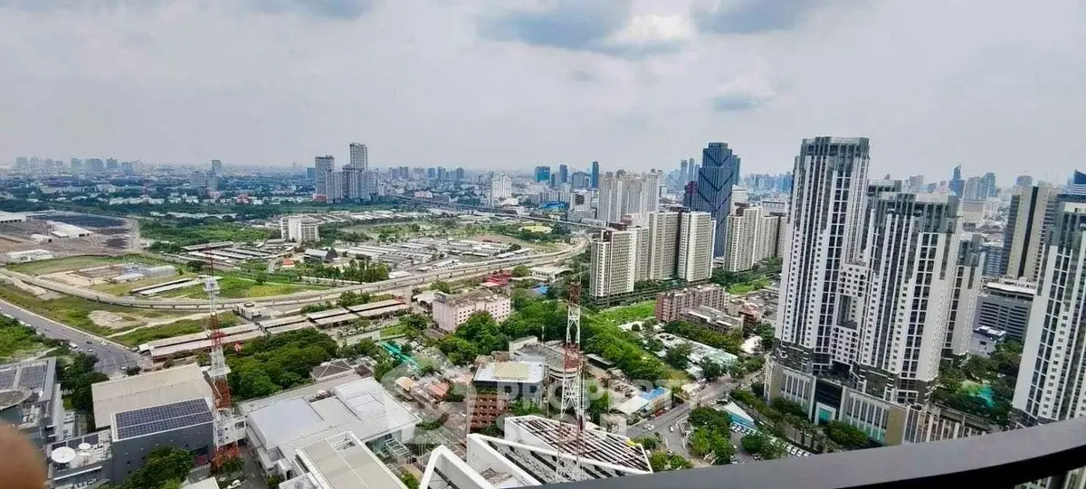 Stunning panoramic cityscape view from high-rise building balcony
