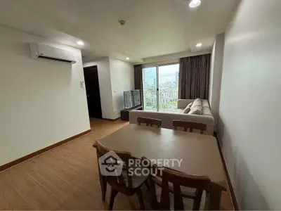 Modern living room with city view and cozy furniture