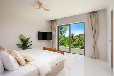Luxurious bedroom with stunning tropical view and modern decor