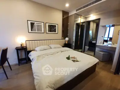 Modern bedroom with elegant decor and ensuite bathroom in luxury apartment