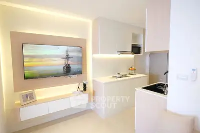 Modern kitchen with sleek cabinetry and integrated appliances in a bright, minimalist design.