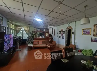 Spacious living room with cozy seating and decorative wall art