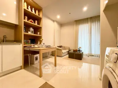 Modern open-plan kitchen and living area with sleek design and natural light
