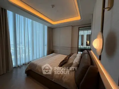 Luxurious bedroom with floor-to-ceiling windows and elegant lighting