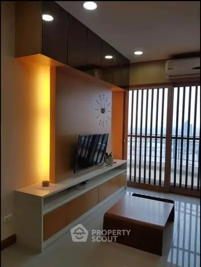 Modern living room with sleek design and large windows offering a stunning view.