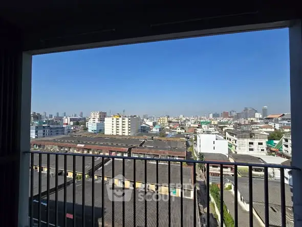 Stunning cityscape view from a high-rise balcony showcasing urban skyline.