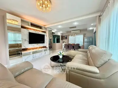 Luxurious living room with elegant leather sofas and modern decor, perfect for relaxation and entertainment.