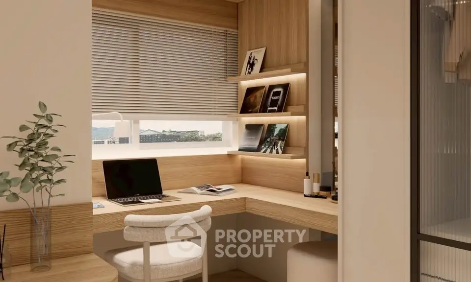Modern study nook with wooden desk, laptop, and decorative shelves in a bright apartment.