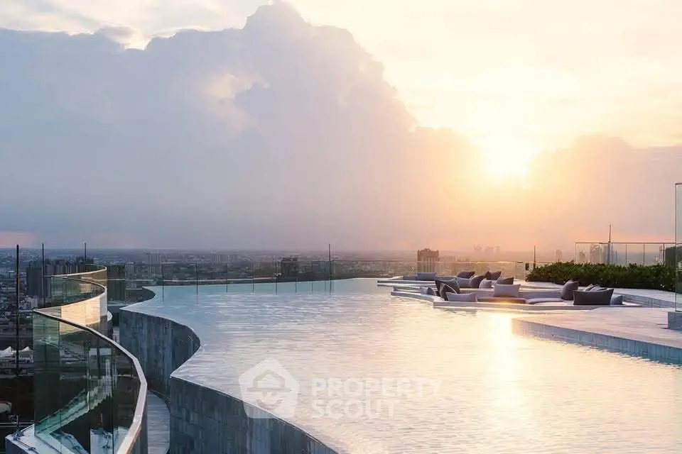 Luxurious rooftop infinity pool with stunning city skyline view at sunset.