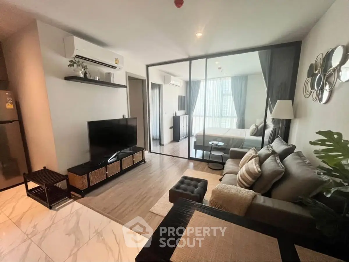 Modern living room with open layout and stylish decor in a contemporary apartment.