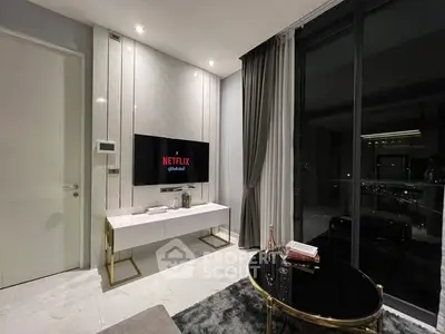 Modern living room with sleek TV setup and elegant decor, perfect for entertainment and relaxation.