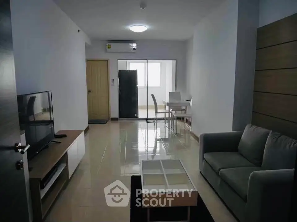 Modern living room with sleek furniture and open layout, perfect for urban living.