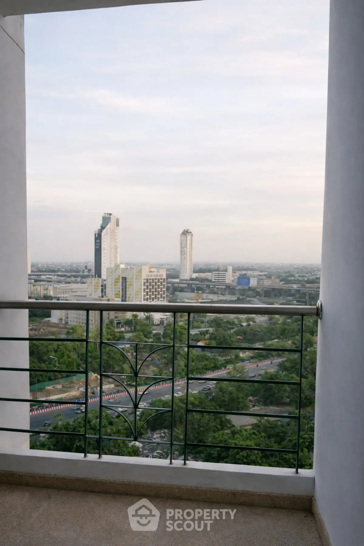 Stunning cityscape view from a high-rise balcony, perfect for urban living enthusiasts.