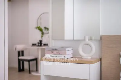 Modern minimalist interior with stylish decor and elegant furniture in a bright living space.
