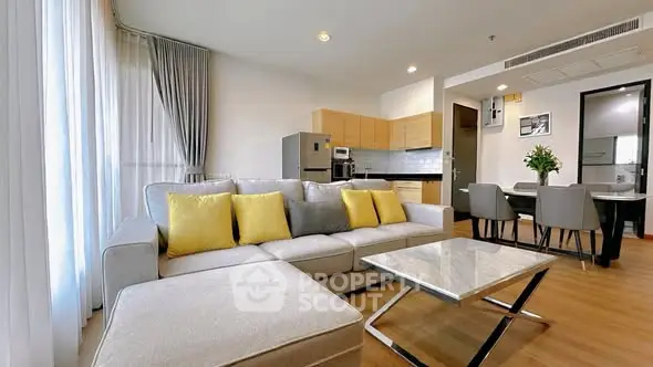 Modern living room with open kitchen and stylish decor