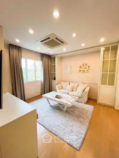 Elegant living room with cozy seating and modern decor