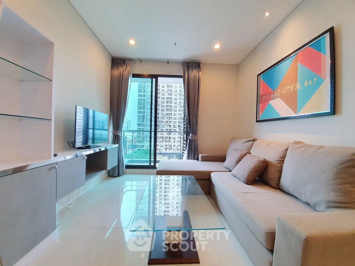 Modern living room with glass coffee table and city view balcony