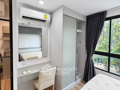 Modern bedroom with air conditioning and large window view