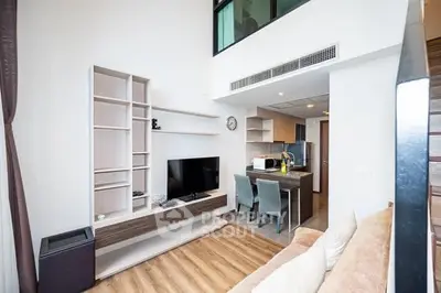 Modern living room with open kitchen and stylish decor