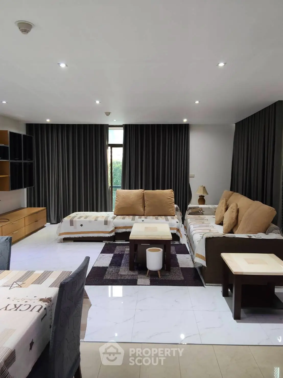 Spacious living room with modern furniture and elegant decor, perfect for relaxation and entertainment.