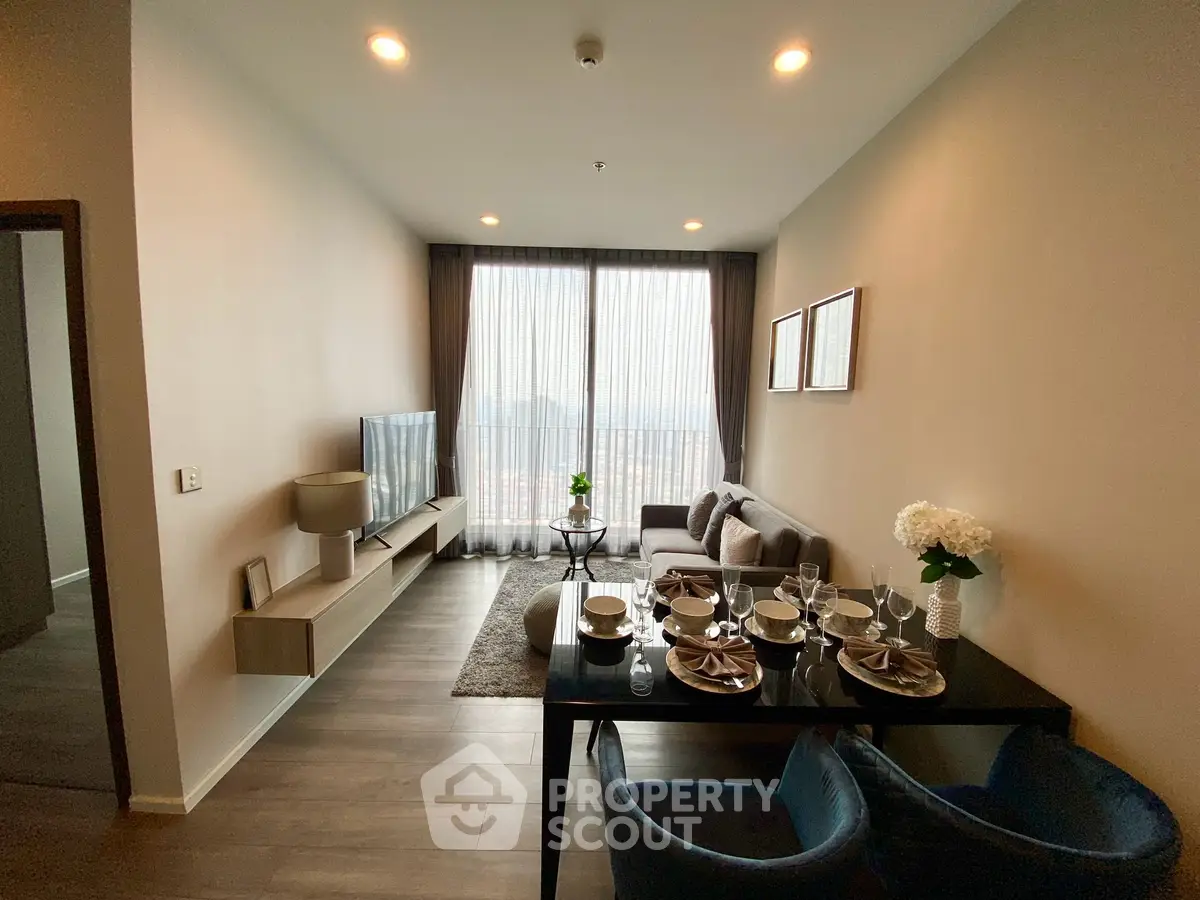 Modern living room with elegant dining area and large window view