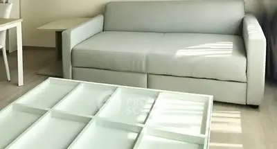 Modern living room with sleek white sofa and stylish coffee table