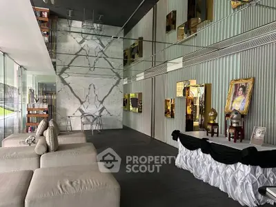 Luxurious modern living room with elegant decor and floor-to-ceiling windows