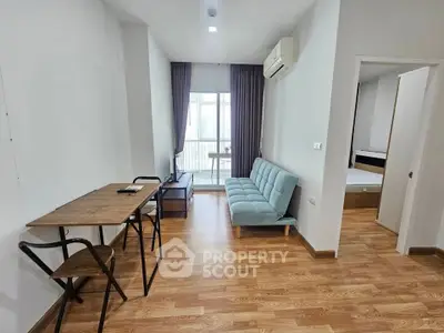 Modern apartment living room with wooden flooring and stylish furniture