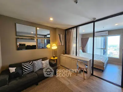 Modern apartment with stylish living room and cozy bedroom, featuring elegant decor and ample natural light.