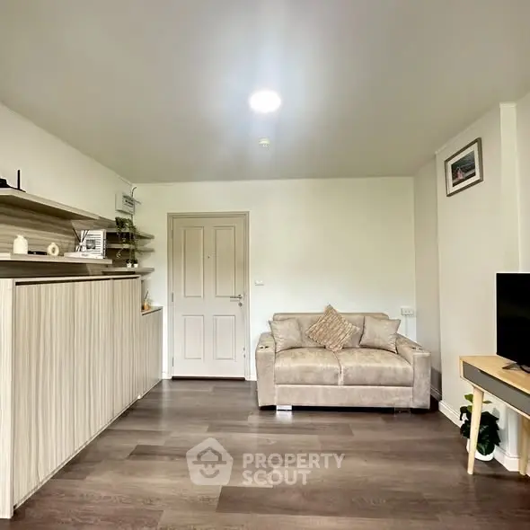 Modern living room with stylish furniture and wooden flooring