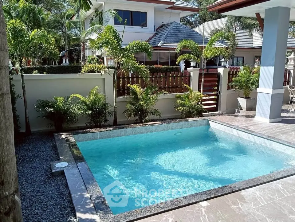Luxurious villa with private pool and lush garden in tropical setting