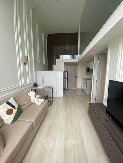Modern loft apartment with stylish living room and open kitchen layout