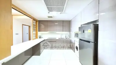 Modern kitchen with sleek cabinetry, stainless steel appliances, and ample counter space.
