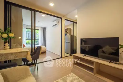 Modern living room with open layout and stylish decor in a cozy apartment.